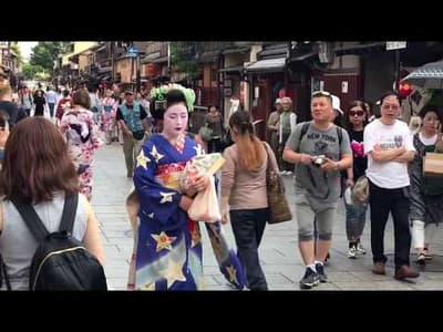Geisha wearing amazing purple kimono in Gion Kyoto Japan (HD)